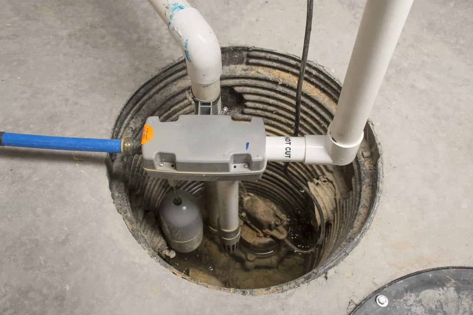 Close up of a sump pump being installed