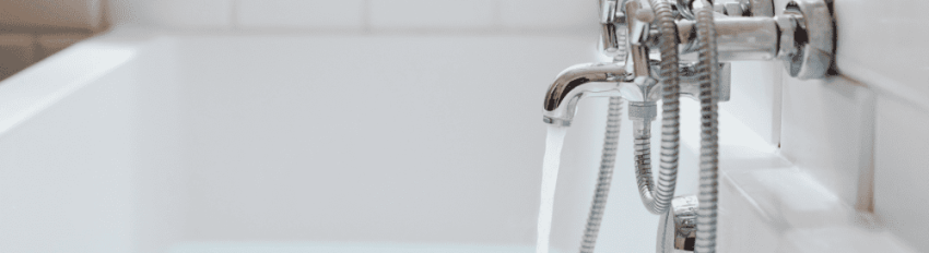 Water running from a tub spout with a shower diverter